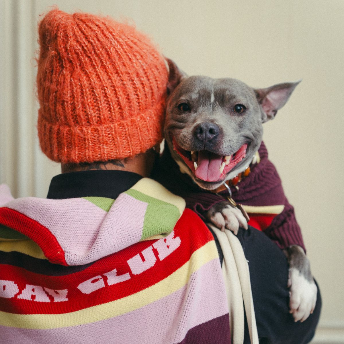 A man and his dog wearing matching Hox x Barc jumpers