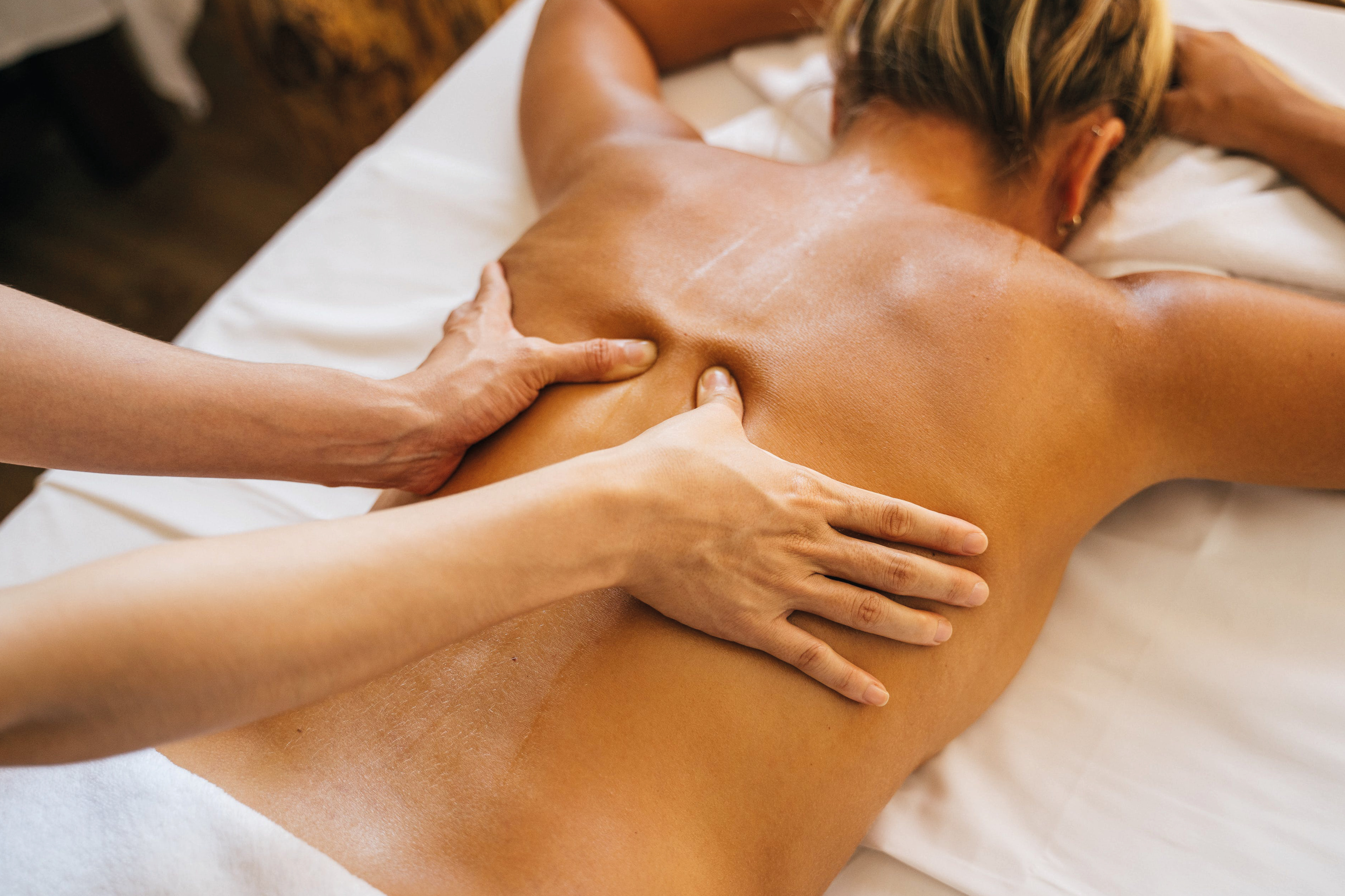 Woman receiving deep-tissue massage in the spa